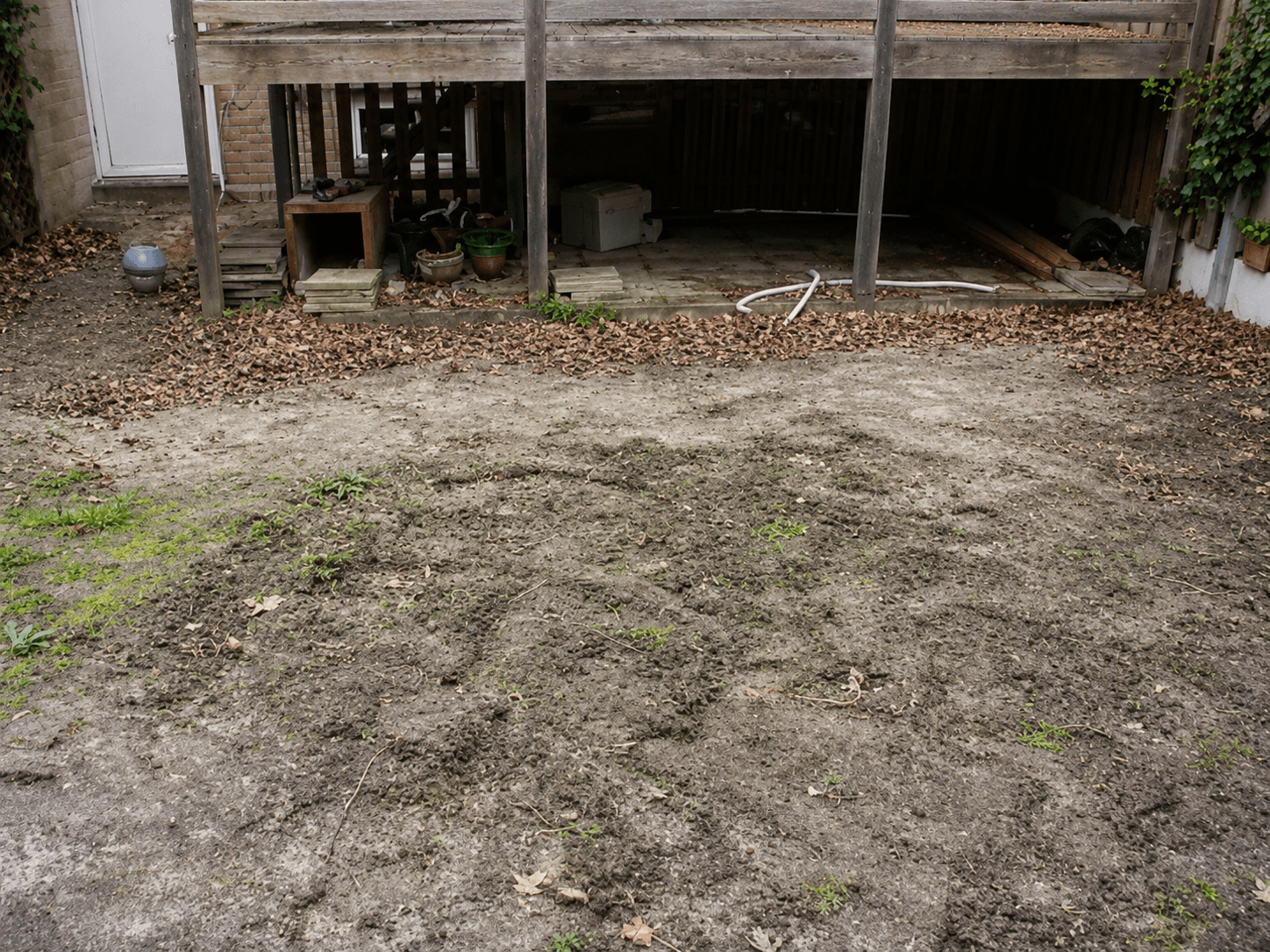 Levelled base in the backyard, prepared for artificial grass and paving.
